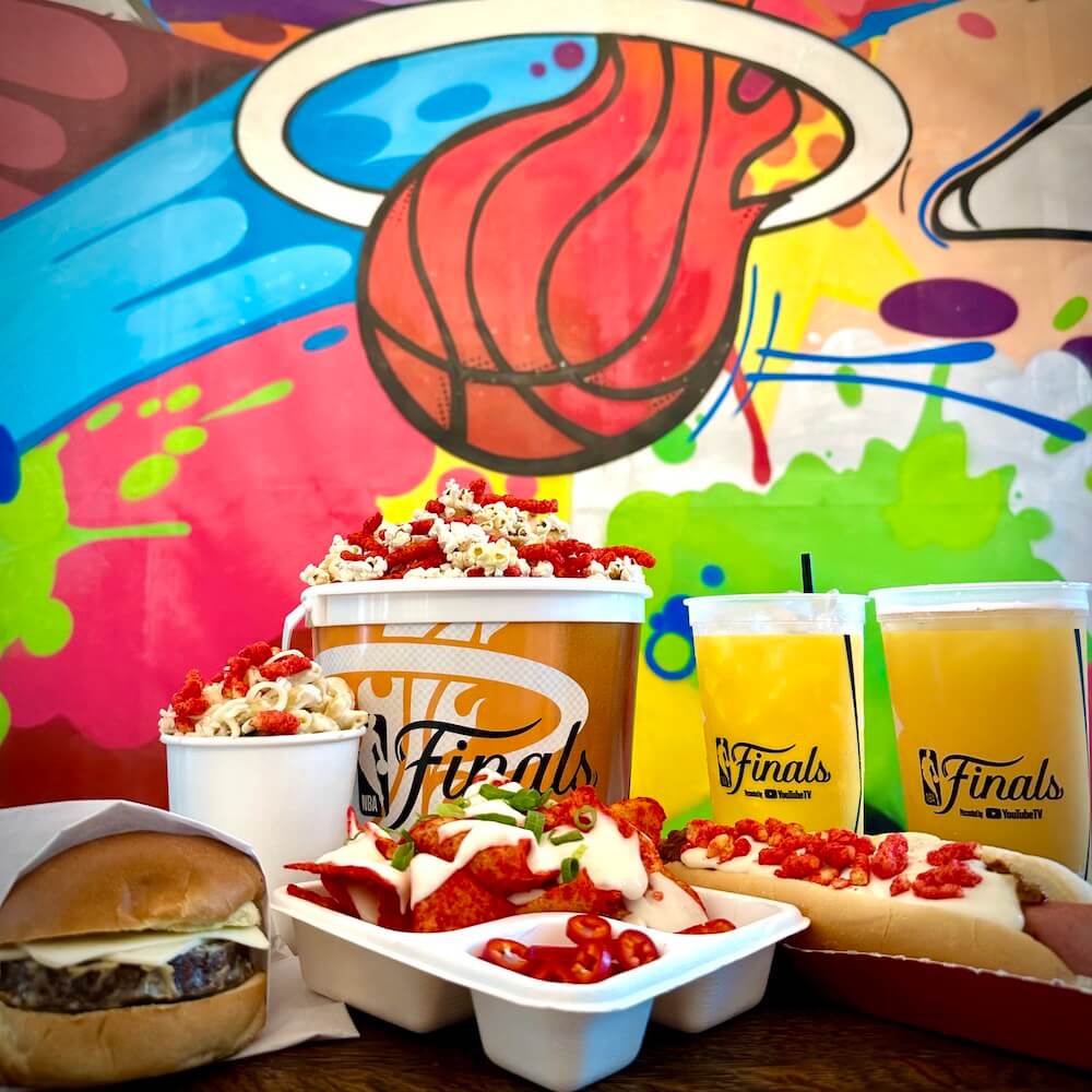 nba finals food spread in front of a basketball mural