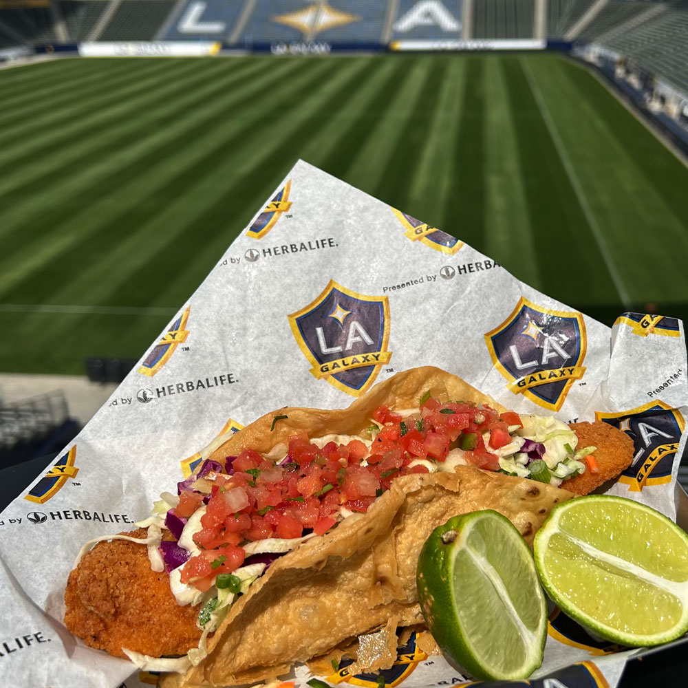 fish taco with soccer field in the background