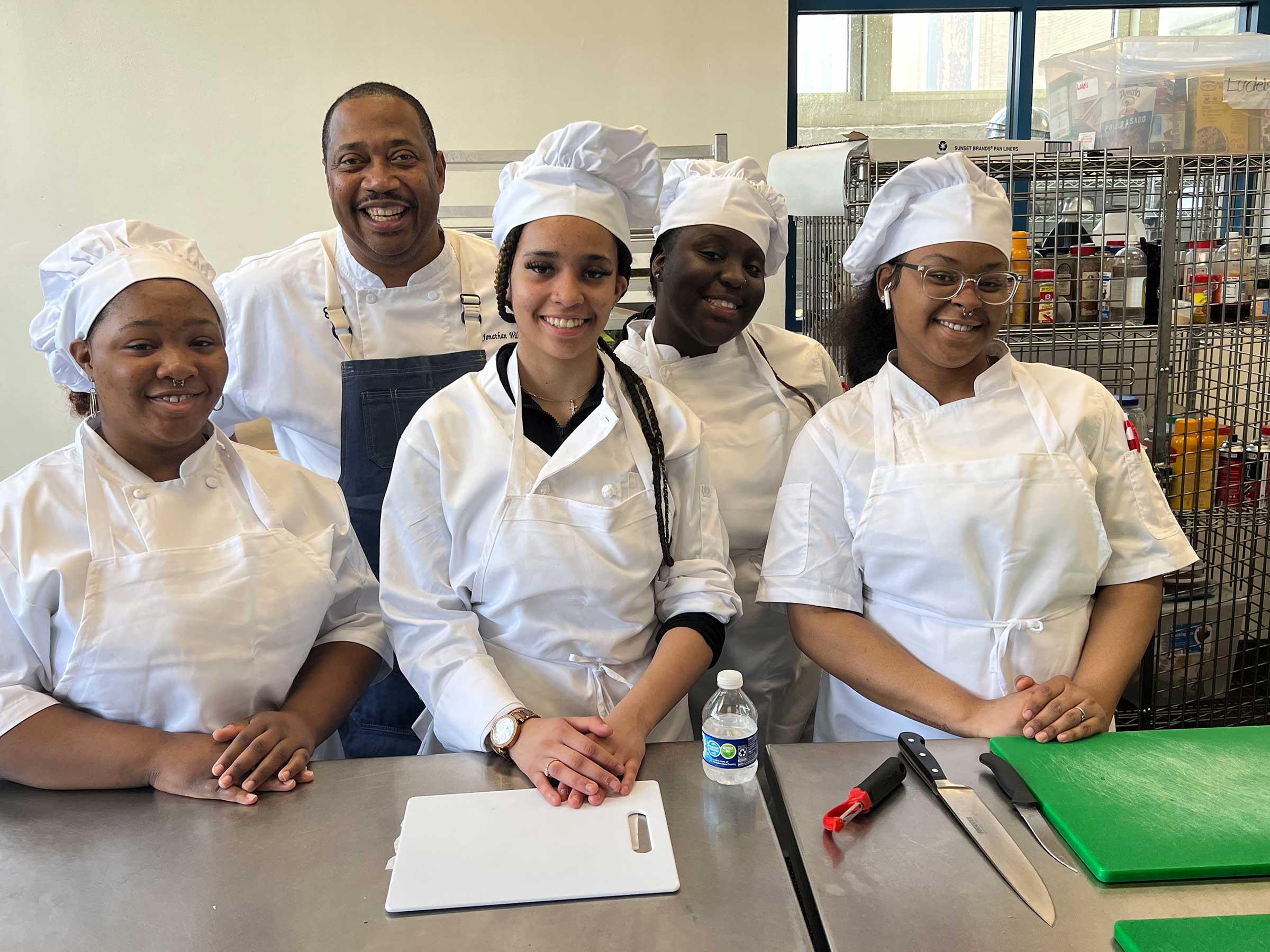 Chef Jonathan Williams with his team of Chicago Vocational High School culinary students