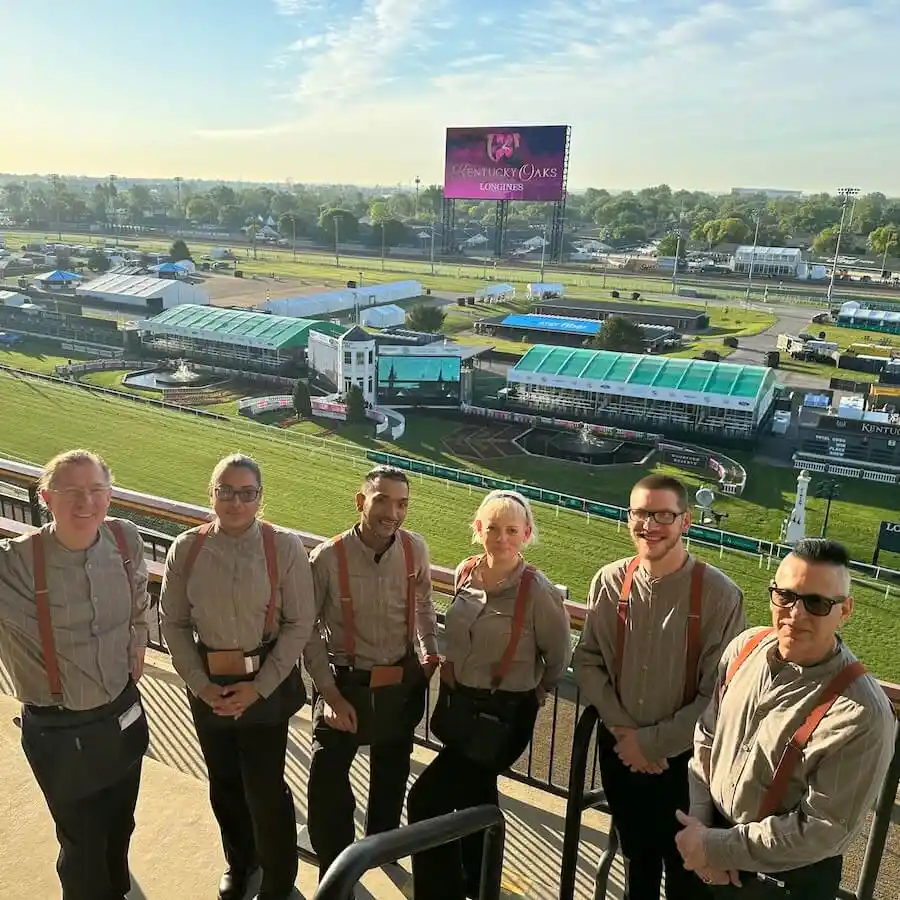 group of team members at the kentucky derby - Mobile Version