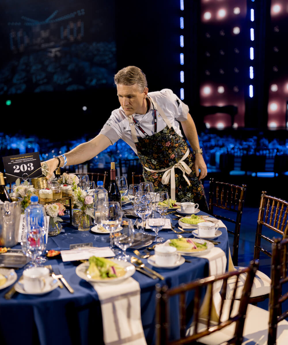 chef adjusting table full of food at the grammy's