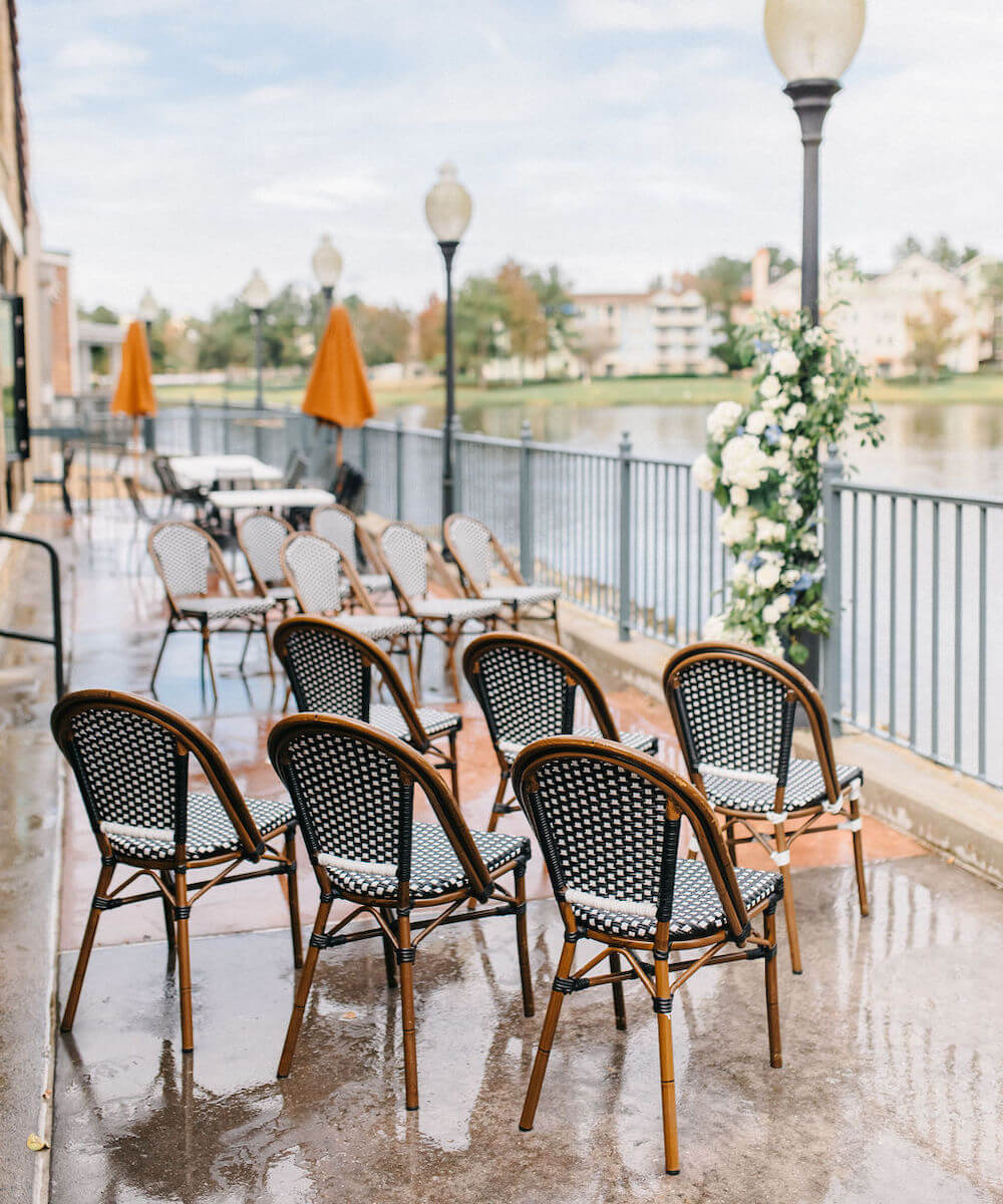 wedding chairs set up on the water in disney springs