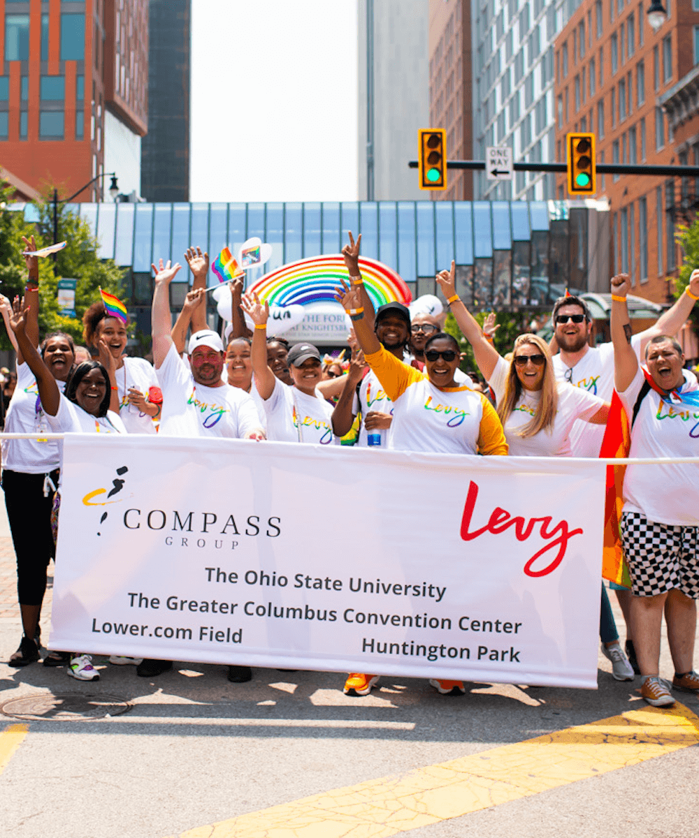 levy team marching in pride parade - mobile version