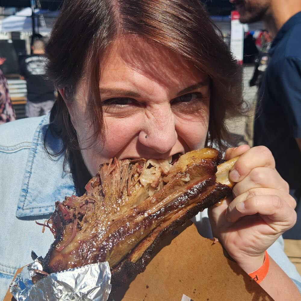 team member eating ribs