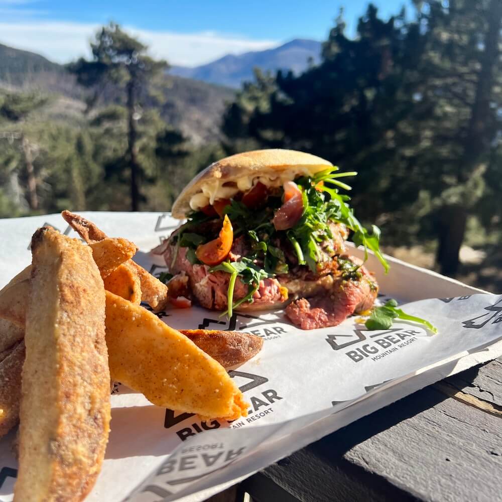big sandwich in front of a mountain