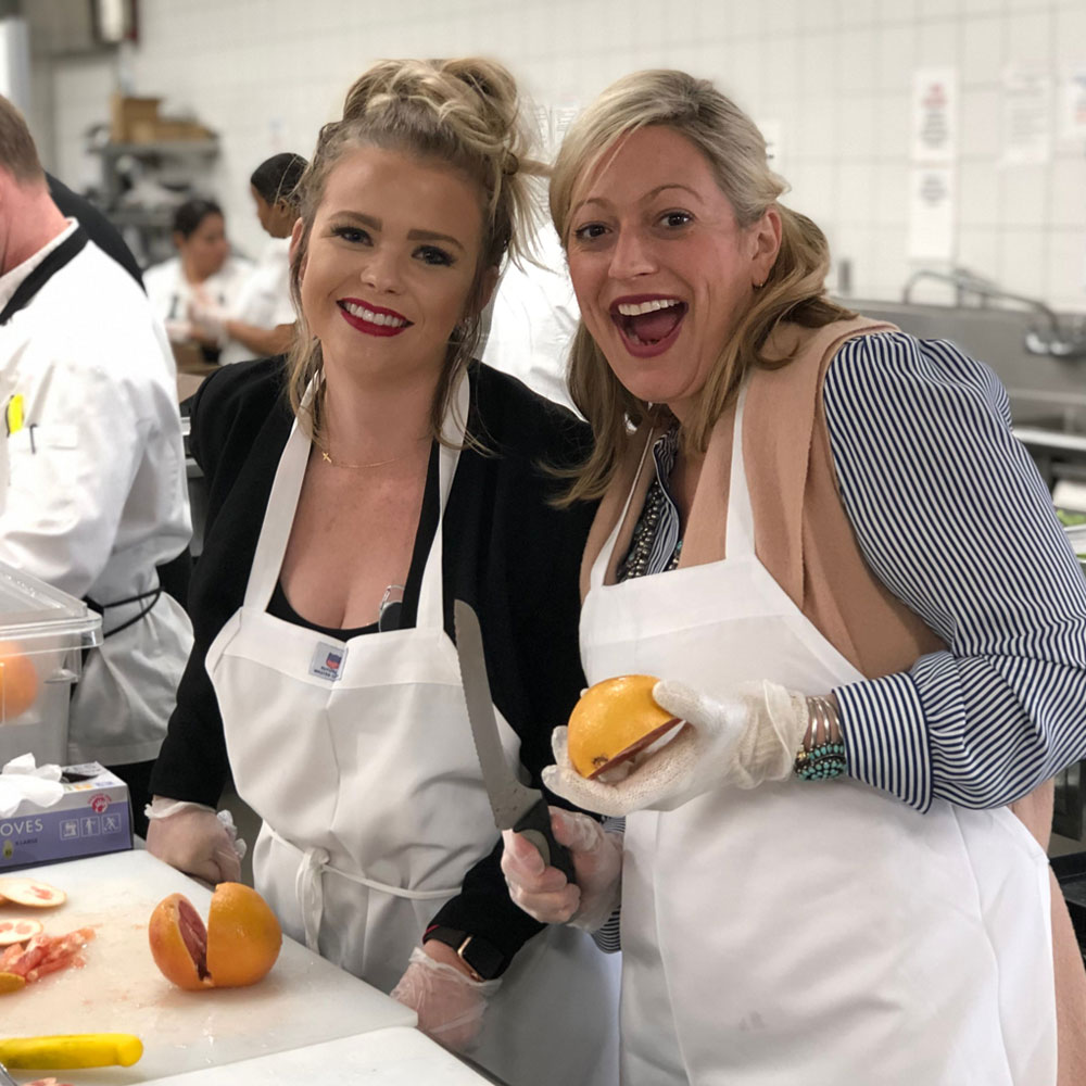 two women preparing food