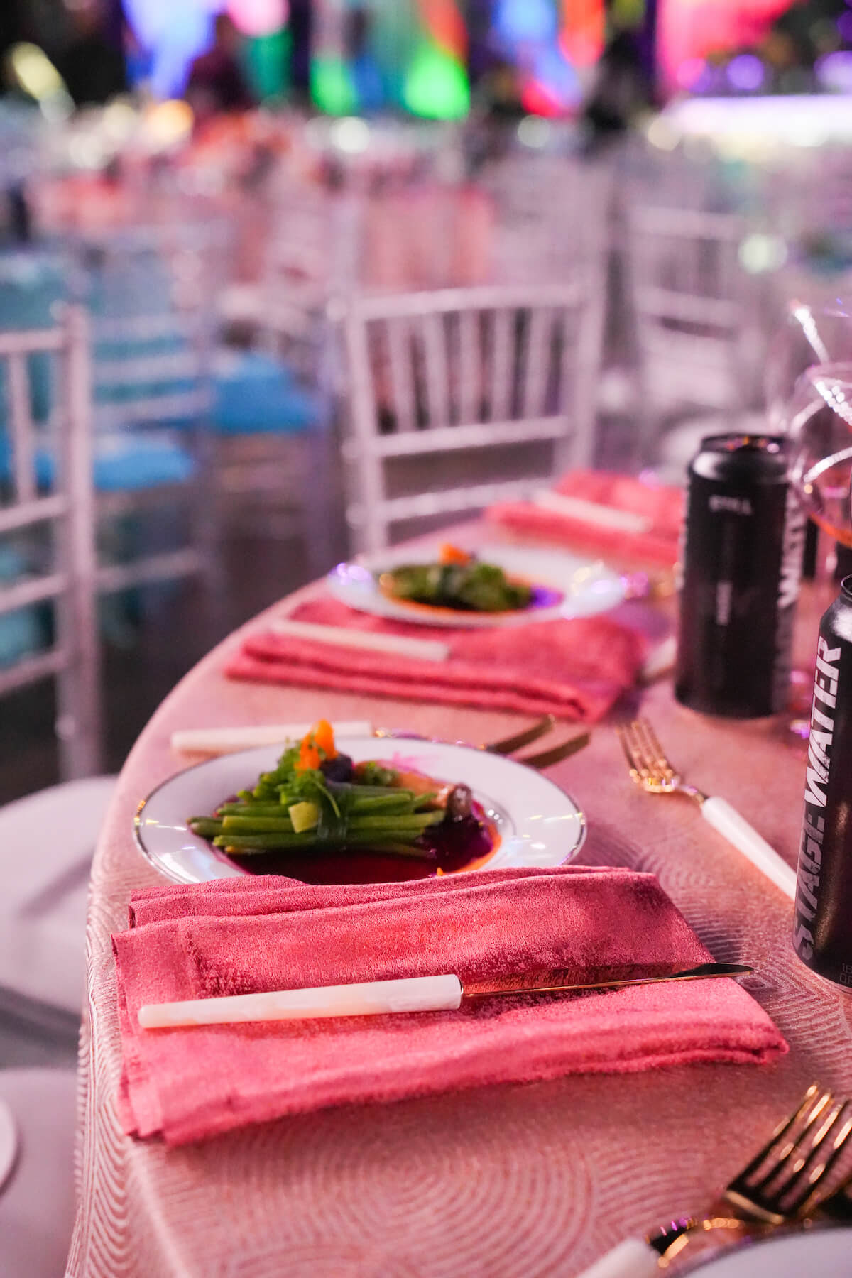 Pink table setting with salad plated