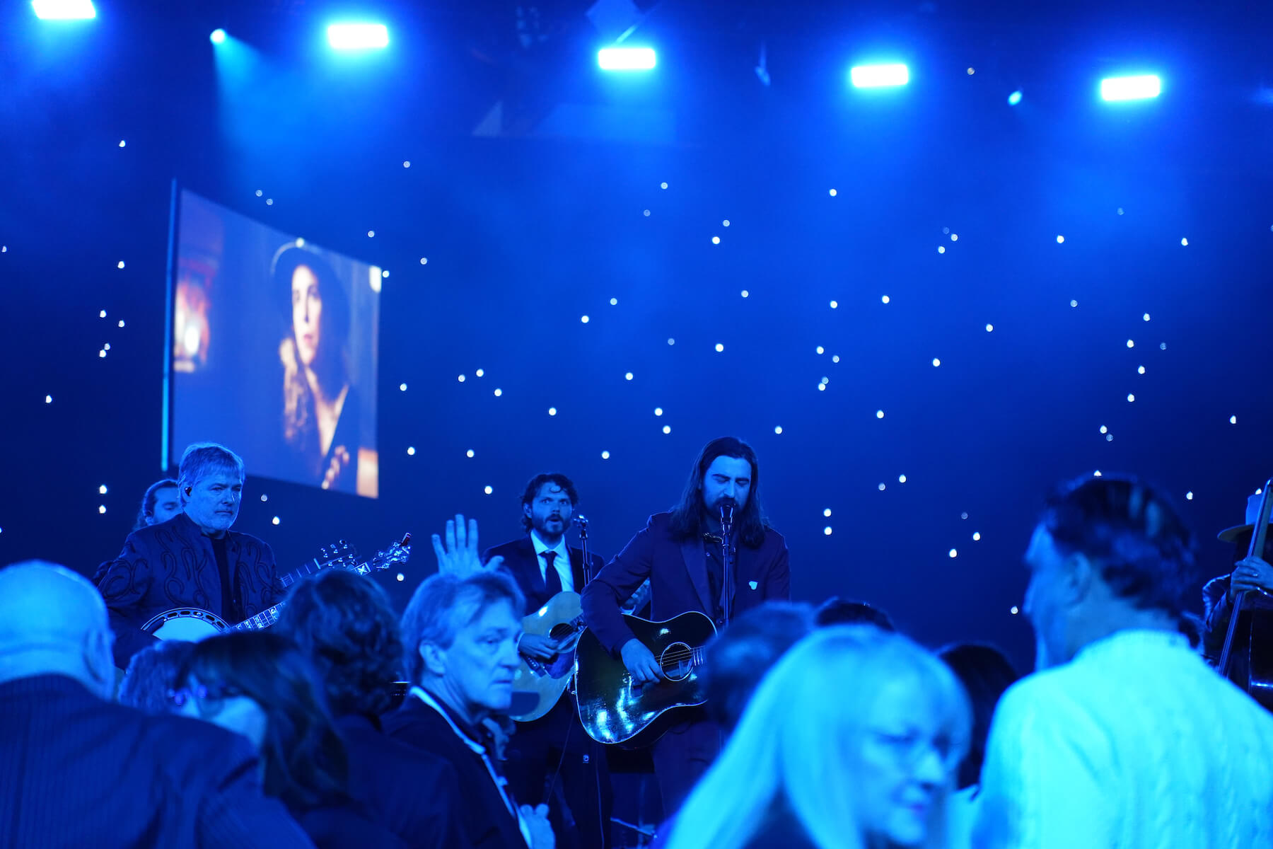 Noah Kahan performing at MusiCares