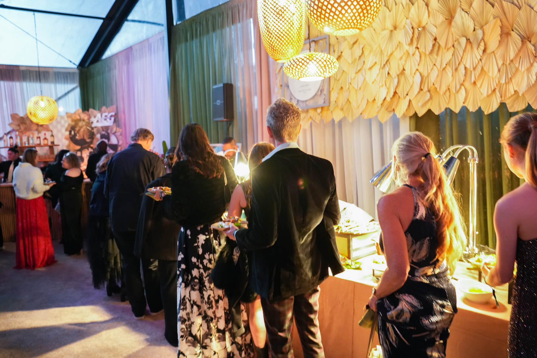 Guests lining up at a Chefs table