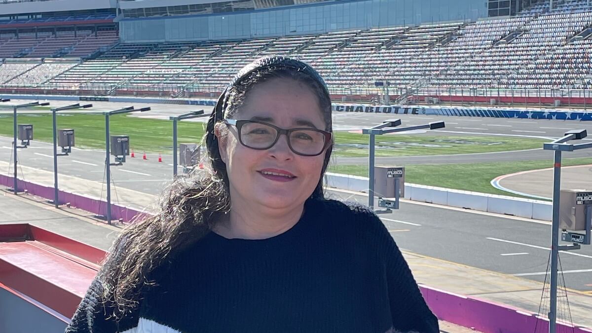 levy team member antoinette at a motor sports venue