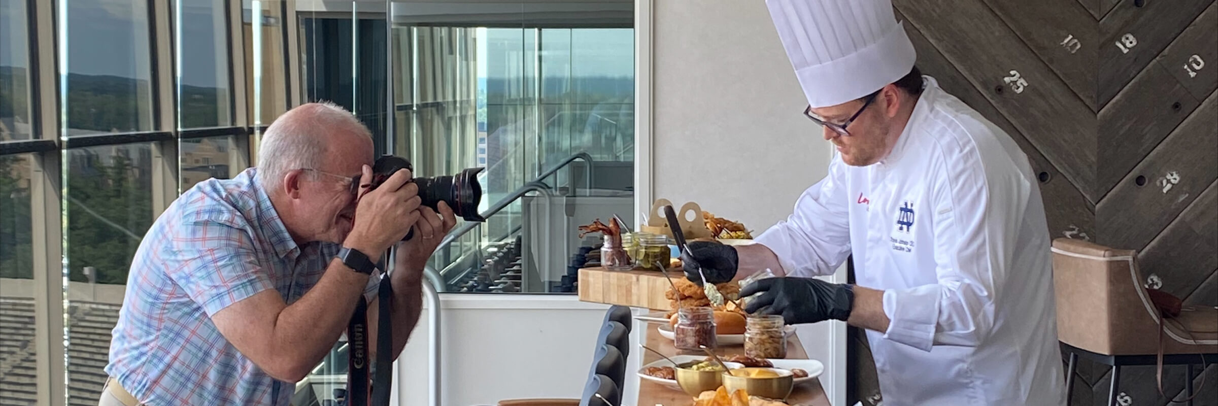 man taking a photo of a chef - Desktop