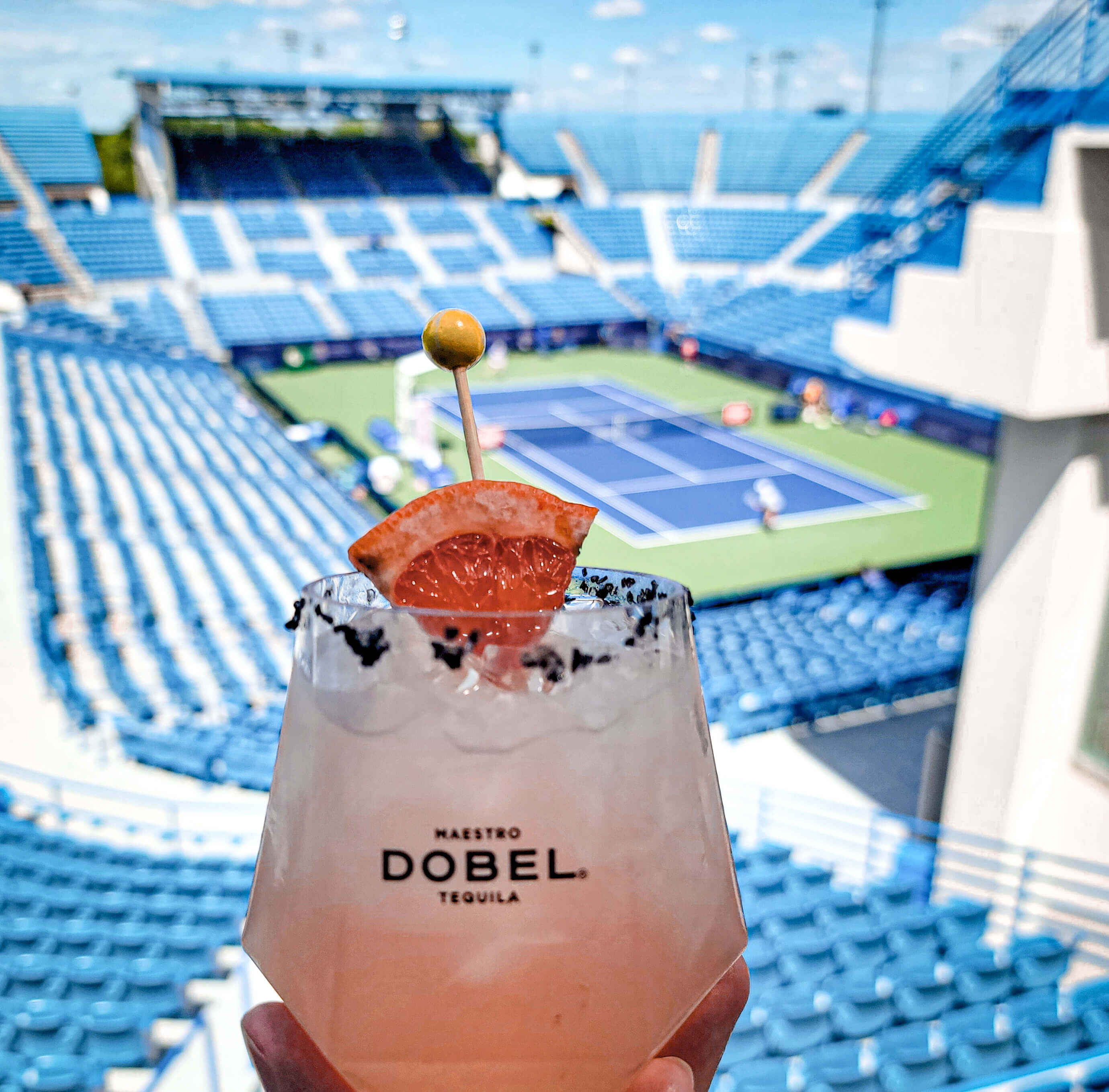 cocktail in front of a tennis stadium